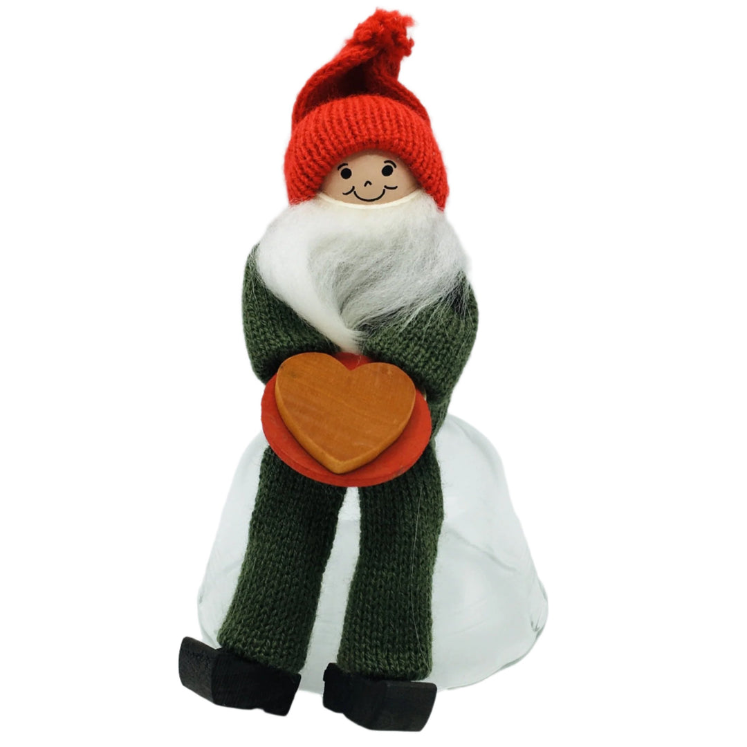 Swedish Tomte Man sitting with Cookie on plate