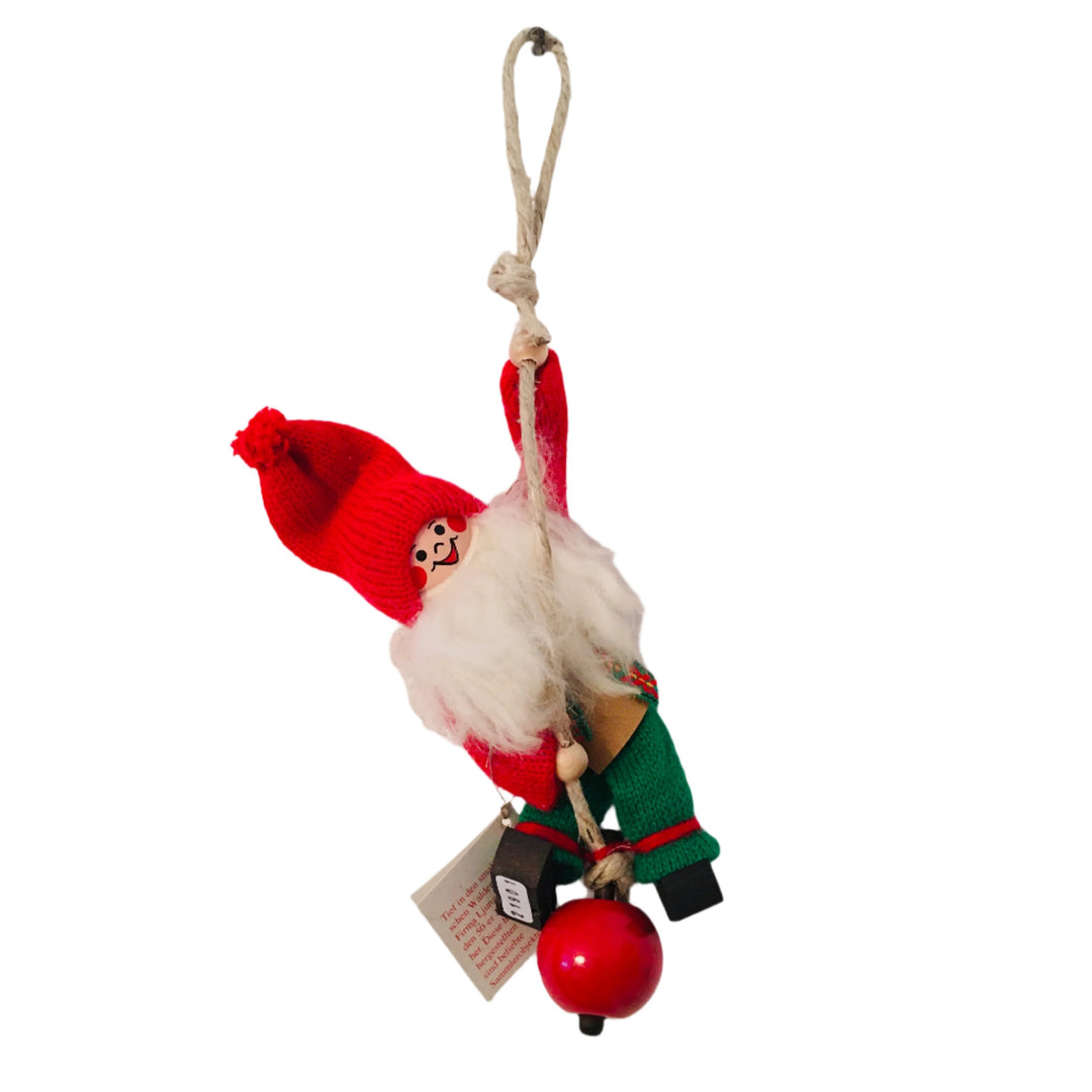 Swedish Tomte Man Climbing Rope with Apple